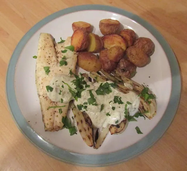 Finished Italian dish Branzino al Forno served on a plate.