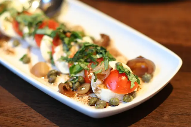 Finished Italian dish Caprese Salad served on a plate.