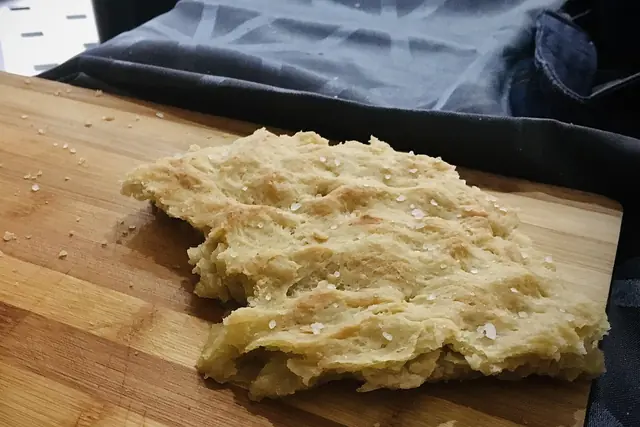 Finished Focaccia Genovese served on a table.
