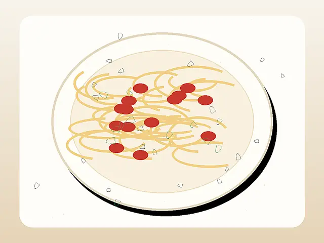 Finished plate of pici all'aglione with thick pasta in tomato garlic sauce.