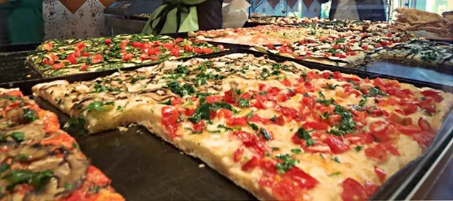 Finished Italian dish Pizza al Taglio served on a plate.