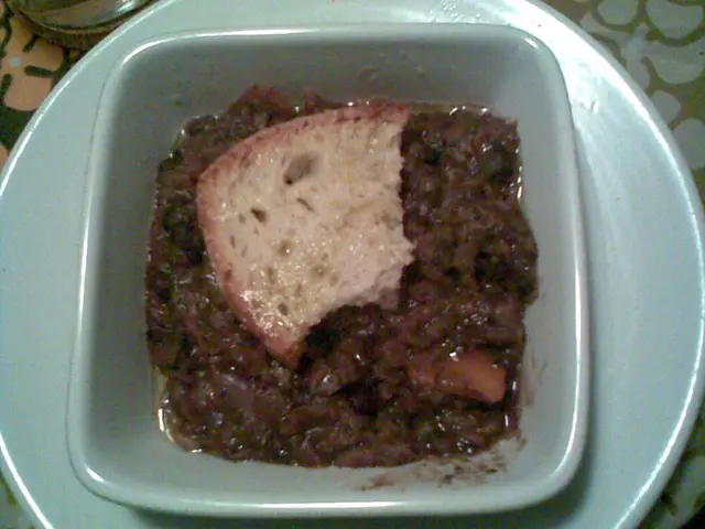 Finished Italian dish Ribollita served on a plate.