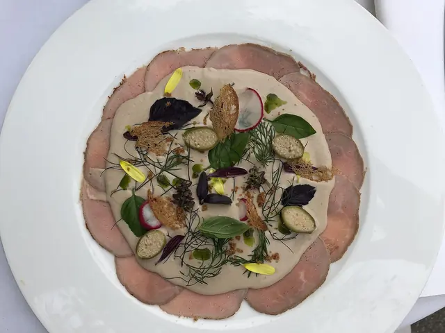 Finished Italian dish Vitello Tonnato served on a plate.
